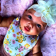 Layna joined the competition — help win amazing prizes! baby, baby_toddler_clothing, cheek, chin, cool, fashion_accessory, happy, head, headgear, iris, lip, magenta, pattern, petal, pink, purple, skin, sleeve, toddler, violet