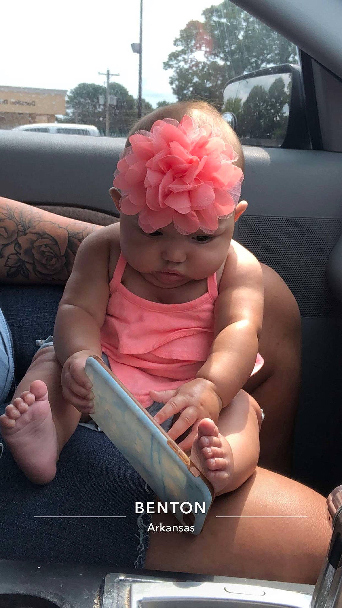 Layna joined the competition — help win amazing prizes! automotive_exterior, automotive_lighting, bumper, car, car_seat, comfort, finger, flower, gesture, hand, headwear, joint, lap, leg, mammal, motor_vehicle, muscle, nail, person, thigh