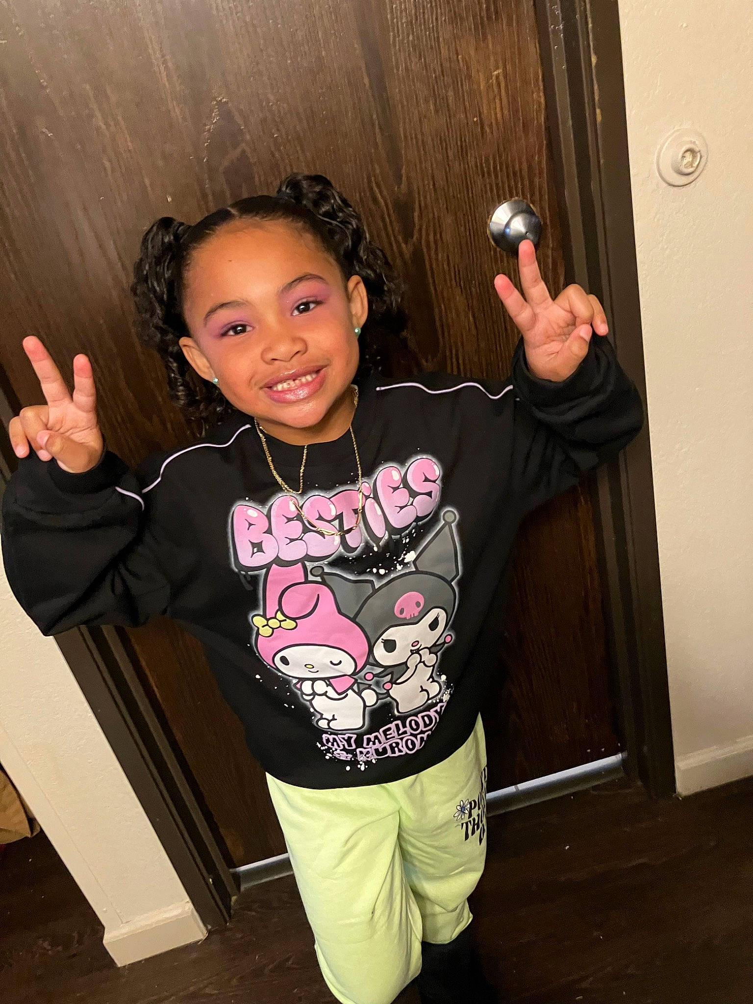 Luna is registered to the contest to win money with this photo: black_hair, child, finger, flash_photography, fun, gesture, hand, happy, joint, joy, neck, person, pink, shoulder, sleeve, smile, standing, t_shirt, thigh, thumb