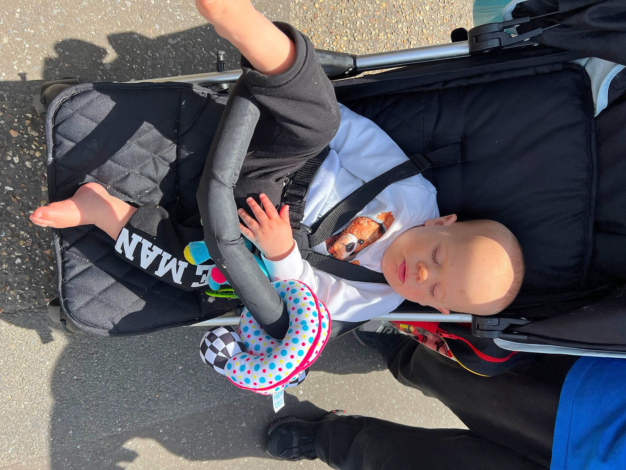 Archie is registered to the contest to win money with this photo: auto_part, automotive_exterior, baby, baby_carriage, baby_products, bag, baggage, child, comfort, fun, human_leg, knee, lap, luggage_and_bags, luxury_vehicle, person, recreation, sitting, thigh, toddler