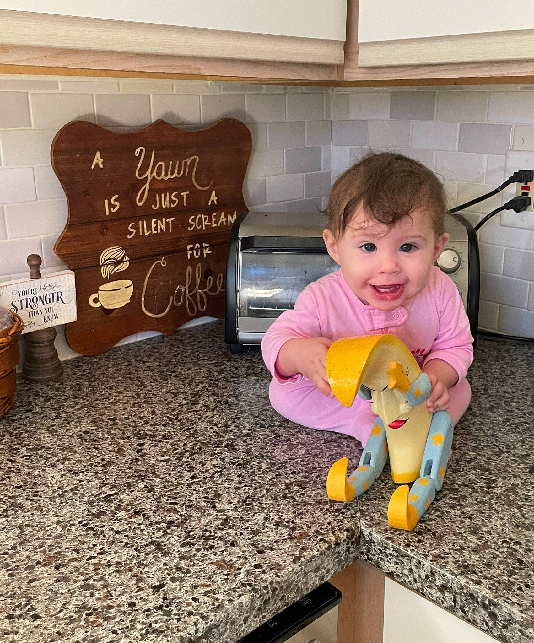 Amaia is registered to the contest to win money with this photo: baby, baby_playing_with_toys, baby_toddler_clothing, blackboard, child, floor, flooring, font, fun, handwriting, happy, mammal, person, play, product, room, sitting, smile, toddler, toy