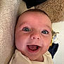Ollie joined the competition — help win amazing prizes! baby, smiling, close_up, face, happy, infant, child, eyes, mouth, skin, blanket, soft, lying_down, indoors, cute, apparel, person, expression, joy, head