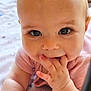 Ambre a rejoint le concours — aidez-le/la à gagner de superbes lots ! baby, infant, closeup, face, hand, fingers, eyes, cheeks, skin, blanket, pattern, star, soft, cute, expression, child, person, portrait, smiling, indoor