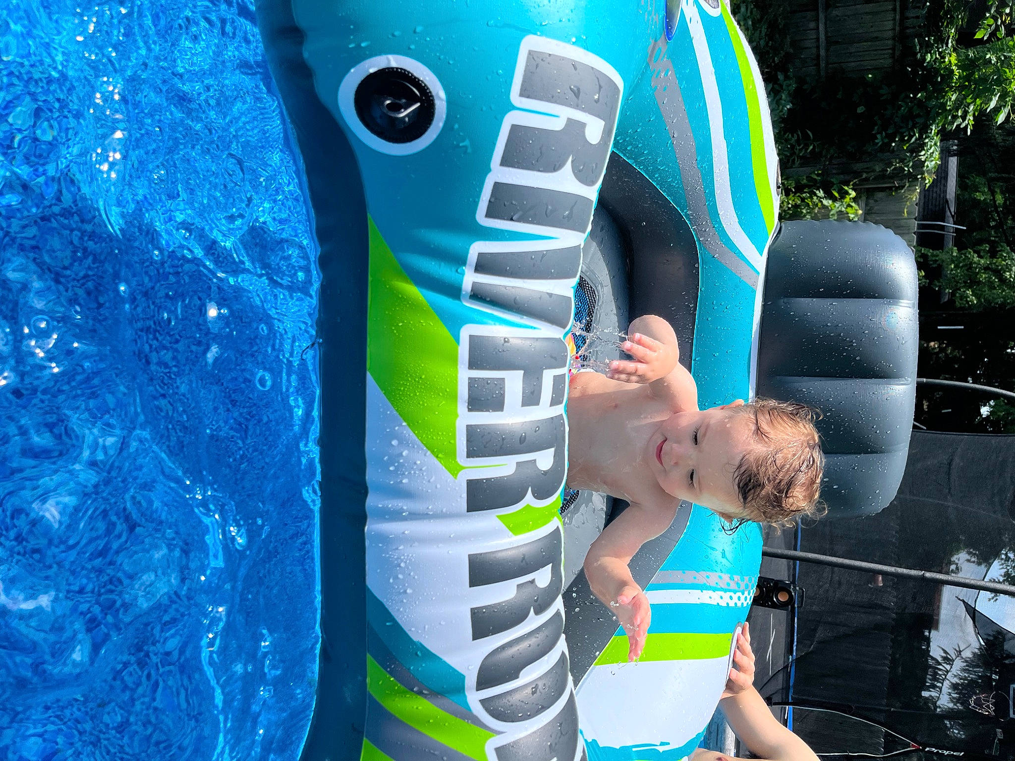 Jody is registered to the contest to win money with this photo: blue, board_short, electric_blue, fun, games, human_leg, inflatable, leisure, outdoor_recreation, person, personal_protective_equipment, play, recreation, shorts, sportswear, swimming_pool, t_shirt, tree, water, world