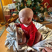 Alaric joined the competition — help win amazing prizes! baby, infant, pacifier, blanket, christmas_tree, presents, holiday, red_clothing, floor, wooden_floor, decorations, festive, indoors, child, sitting, cute, toddler, home, wrapped_gifts, christmas