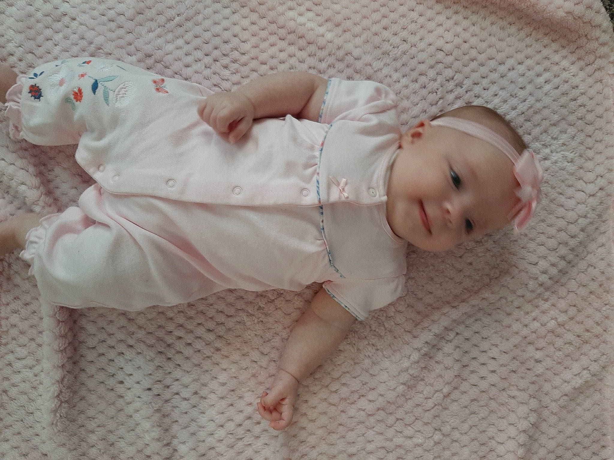 Lillie-mae joined the competition — help win amazing prizes! baby, baby_toddler_clothing, child, comfort, doll, finger, flooring, foot, head, headwear, human_body, human_leg, linens, lip, pattern, person, pink, sitting, skin, sleeve