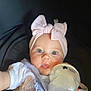 Marnie-Maria is registered to the contest to win money with this photo: baby, child, bottle, headband, pink, blue_eyes, milk, hand, clothing, portrait, infant, indoor, cute, feeding, person, face, closeup, soft_light, expression, seat