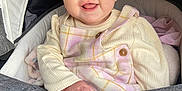 Marnie-Maria joined the competition — help win amazing prizes! baby, child, smiling, face, stroller, infant, clothing, cute, happy, person, portrait, sitting, pink, yellow, cream, apparel, hand, hood, fabric, closeup