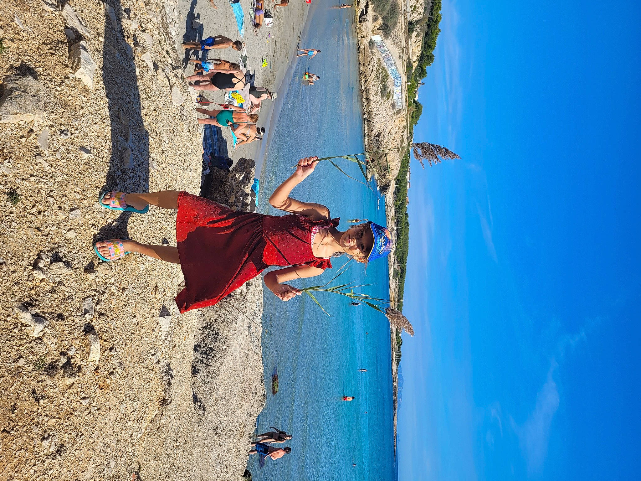 Célia participe au concours pour gagner de l'argent avec cette photo : adventure, azure, beach, climbing, climbing_harness, electric_blue, extreme_sport, formation, headwear, joy, landscape, leisure, people_in_nature, person, recreation, rock_climbing_equipment, sky, slope, sport_climbing, travel