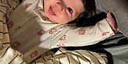 Selah is registered to the contest to win money with this photo: baby, bed, blanket, child, clothing, cute, eyes, face, hair, happy, indoors, infant, lying_down, onesie, person, pillow, skin, smile, stretching, striped_blanket
