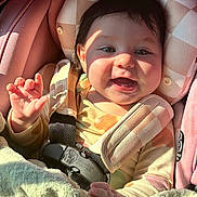 Selah joined the competition — help win amazing prizes! baby, blanket, car_seat, child, clothing, colorful, cute, face, hand, happy, head, indoor, infant, portrait, seatbelt, smiling, soft_texture, sunlight, teething_toy, toy