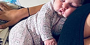 Selah joined the competition — help win amazing prizes! baby, sleeping, pajamas, bear_pattern, child, infant, closeup, cuddling, hand, black_clothing, indoor, window_blinds, peaceful, portrait, soft_light, cozy, resting, person, cute, nap