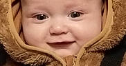 O'Ryen is registered to the contest to win money with this photo: baby, bear_costume, child, chubby_cheeks, closeup, clothing, costume, cute, eyes, face, fur, happy, hood, infant, portrait, seatbelt, smile, straps, warm, zipper