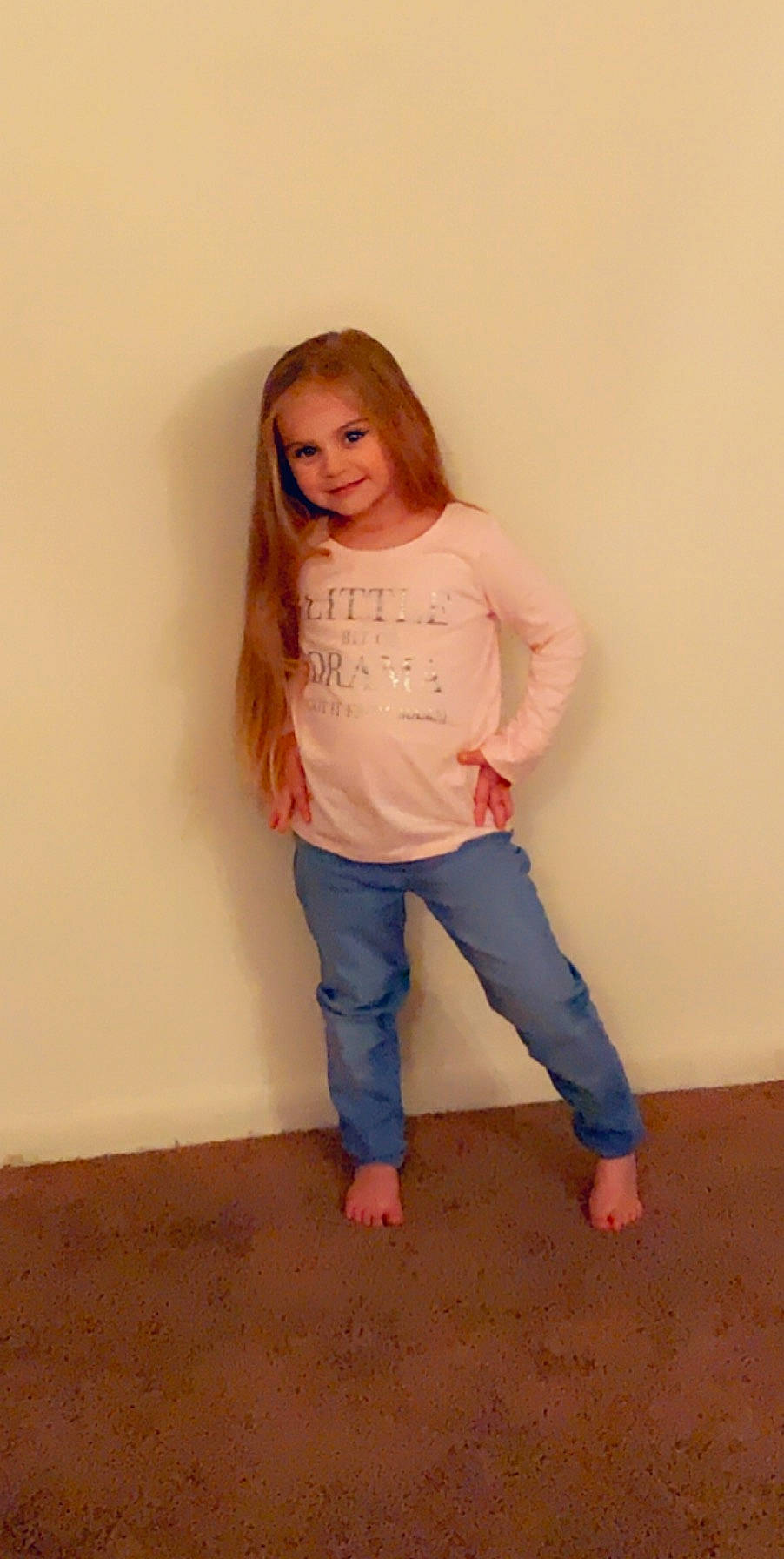 Nicole is registered to the contest to win money with this photo: abdomen, arm, denim, flooring, gesture, happy, human_body, human_leg, joy, knee, leg, long_hair, neck, outerwear, person, sleeve, smile, t_shirt, thigh, trunk