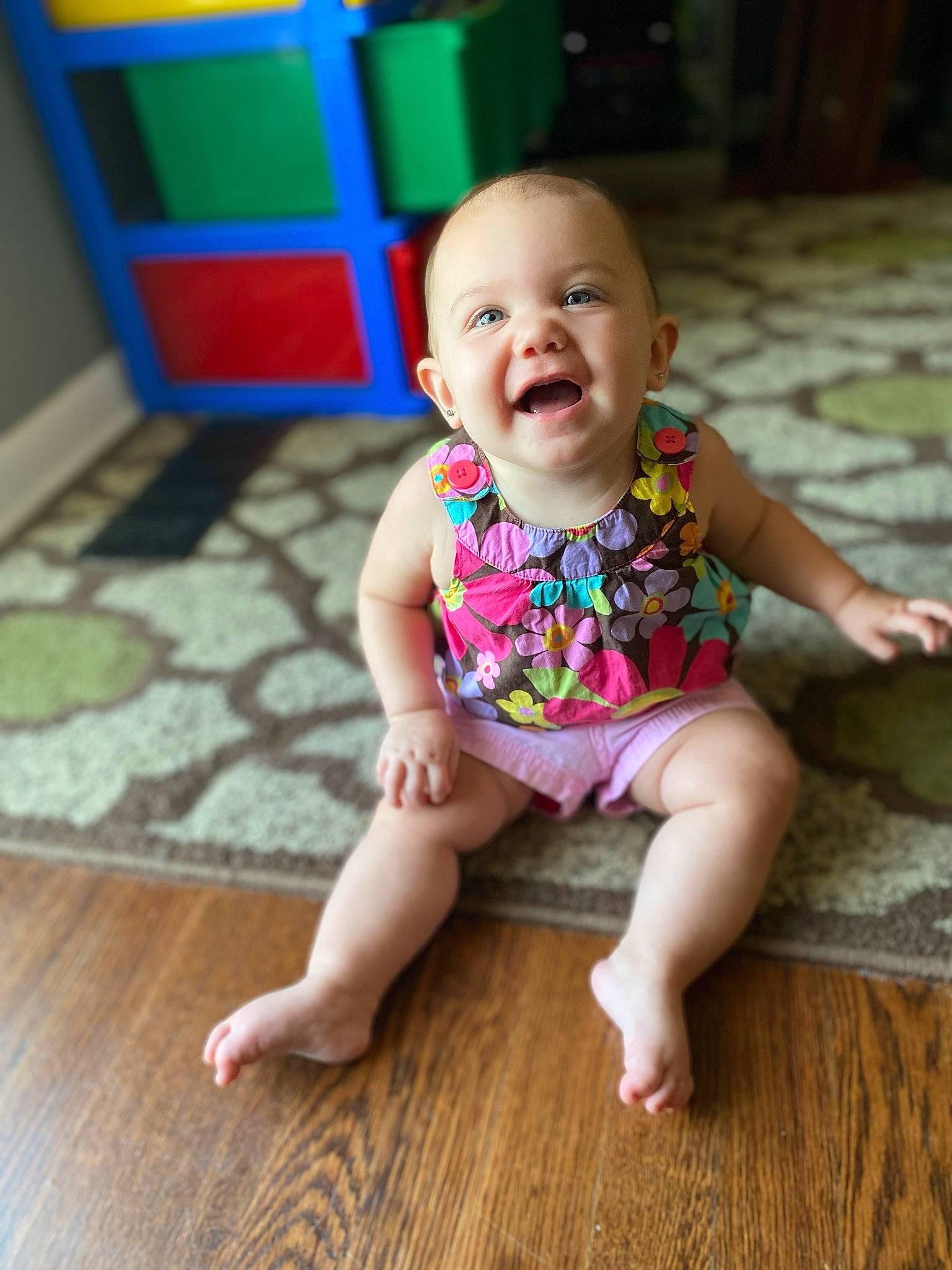 Raelyn is registered to the contest to win money with this photo: baby, baby_toddler_clothing, beauty, cheek, child, face, facial_expression, floor, flooring, fun, happy, head, person, photography, pink, play, sitting, skin, smile, toddler