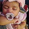 adorable, arm, baby, child, closeup, cute, face, hand, headband, indoor, infant, newborn, pacifier, peaceful, person, pink_clothing, resting, sleeping, soft_texture, toddler