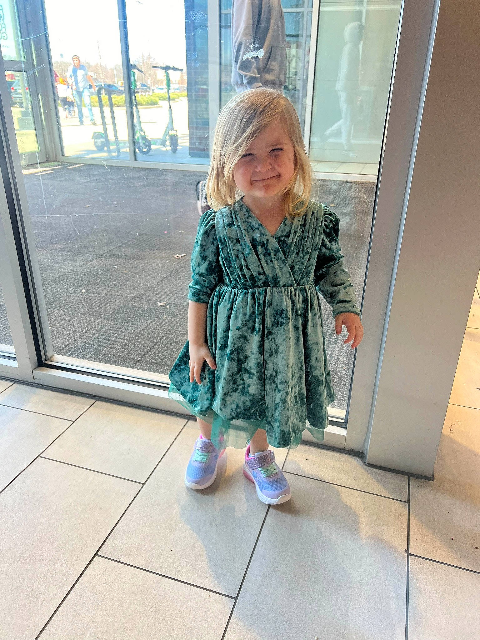 Kylee joined the competition — help win amazing prizes! baby_toddler_clothing, blond, dress, floor, flooring, fun, happy, human_leg, joy, leg, leisure, pattern, person, shoe, sleeve, smile, sneakers, t_shirt, thigh, toddler