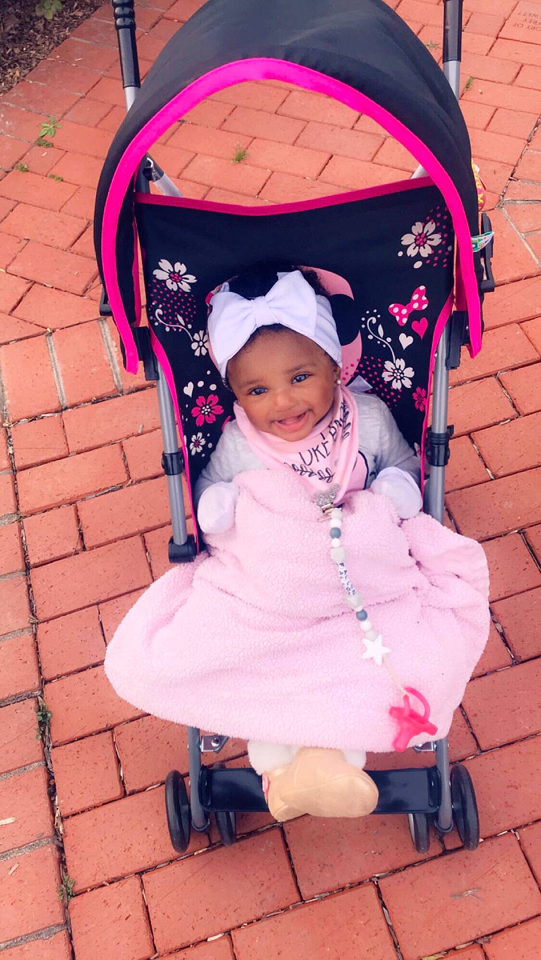 Fallon is registered to the contest to win money with this photo: baby, baby_carriage, baby_products, child, headgear, joy, person, pink, product, smile, toddler