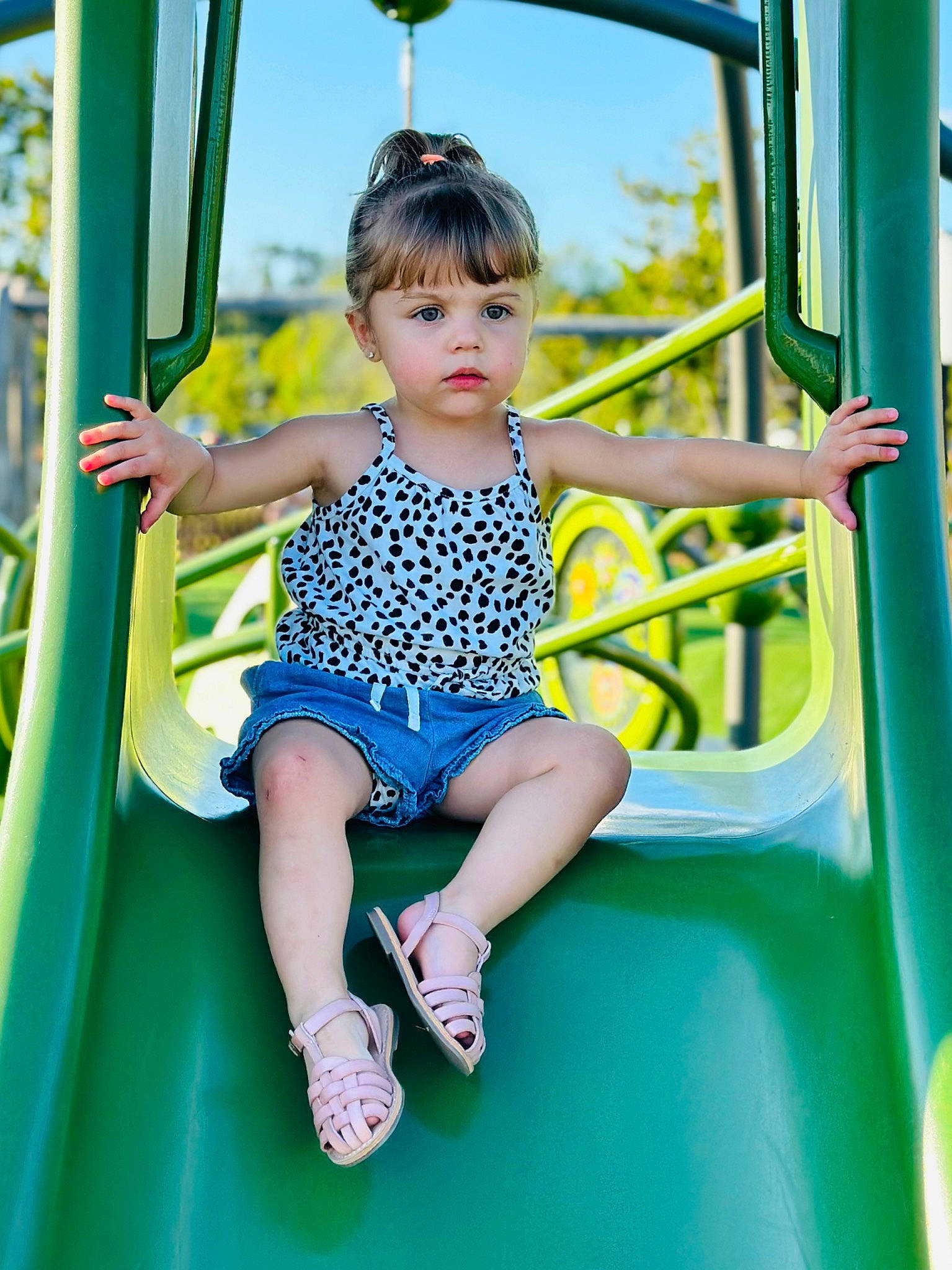 Ayla joined the competition — help win amazing prizes! baby_toddler_clothing, blue, child, chute, city, electric_blue, fun, grass, green, happy, leisure, outdoor_play_equipment, person, play, playground, playground_slide, recreation, sky, standing, t_shirt