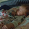 Lila joined the competition — help win amazing prizes! baby, sleeping, blanket, pillow, floral, indoor, child, peaceful, cozy, radiator, bedroom, rest, comfort, soft_lighting, infant, person, young_child, clothing, hand, face