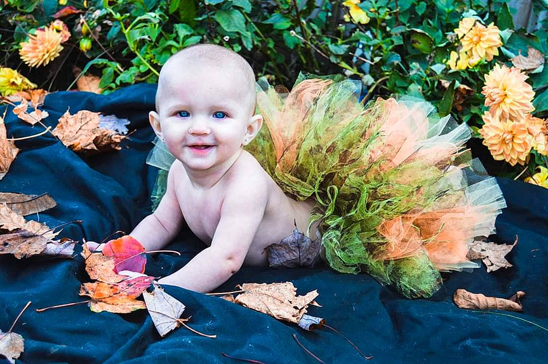 Daisy-mae is registered to the contest to win money with this photo: autumn, baby, child, child_model, costume, fawn, fictional_character, flower, joy, leaf, person, petal, photo_shoot, photography, plant, portrait, toddler