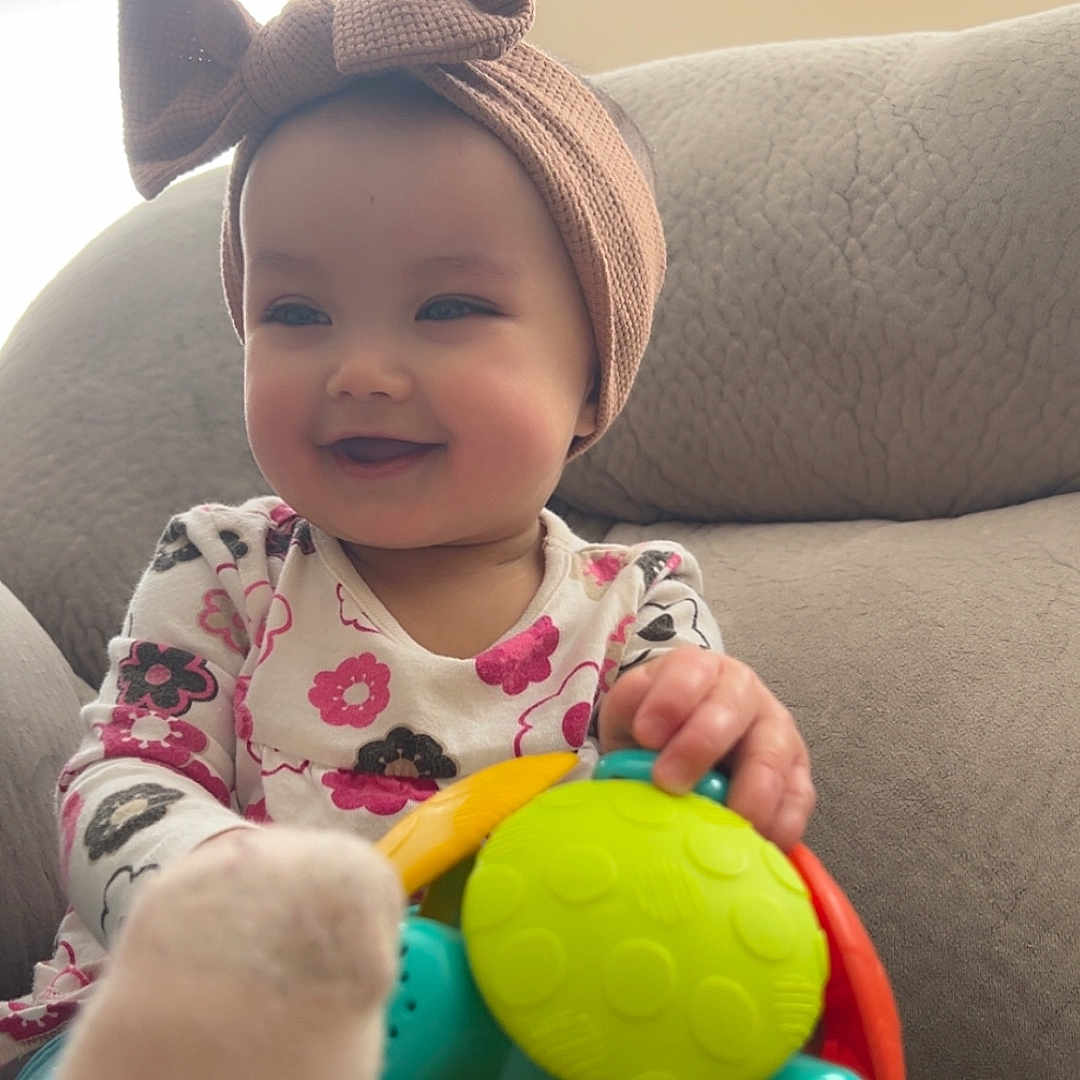 Shylah is registered to the contest to win money with this photo: architecture, baby, boy, building, cap, child, clothing, couch, face, furniture, hat, head, indoors, livingroom, male, person, photography, portrait, room, toy