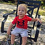 Mark is registered to the contest to win money with this photo: backyard, black_chair, boy, casual, chair, child, crocs, daylight, footwear, grass, nature, outdoor, person, red_shirt, sand, shorts, sunlight, toddler, tree, under_armour