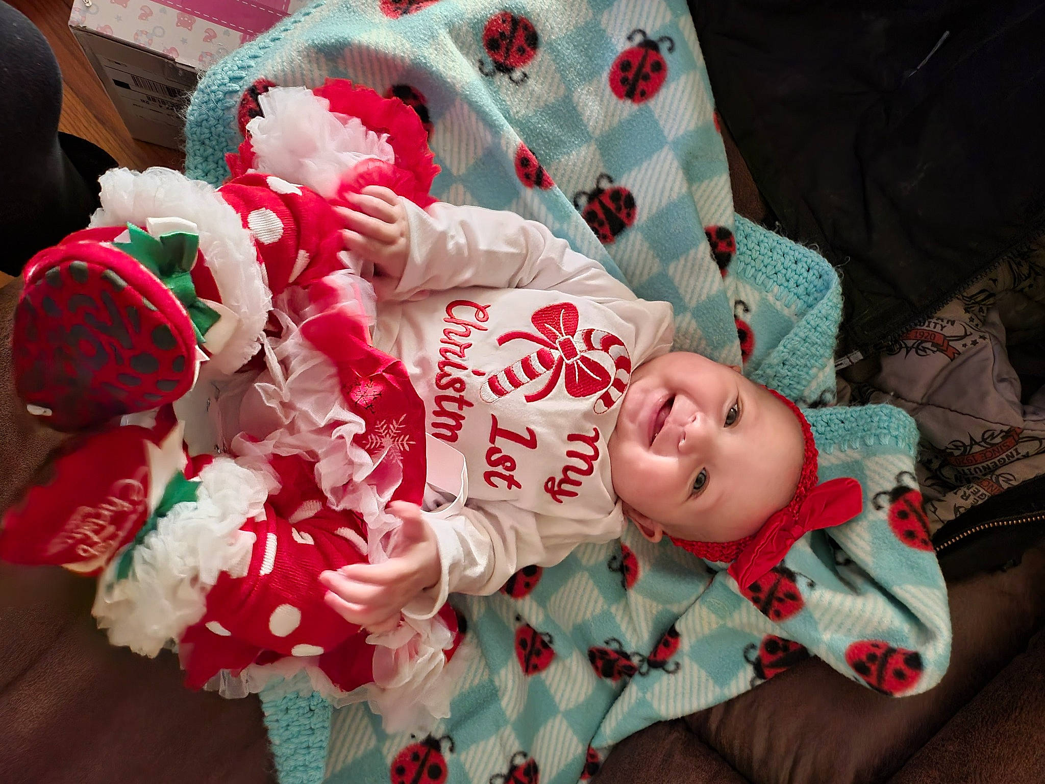 Priya is registered to the contest to win money with this photo: baby, baby_toddler_clothing, carmine, child, christmas, christmas_eve, comfort, event, fur, happy, headwear, holiday, linens, pattern, person, pink, room, sleeve, smile, textile