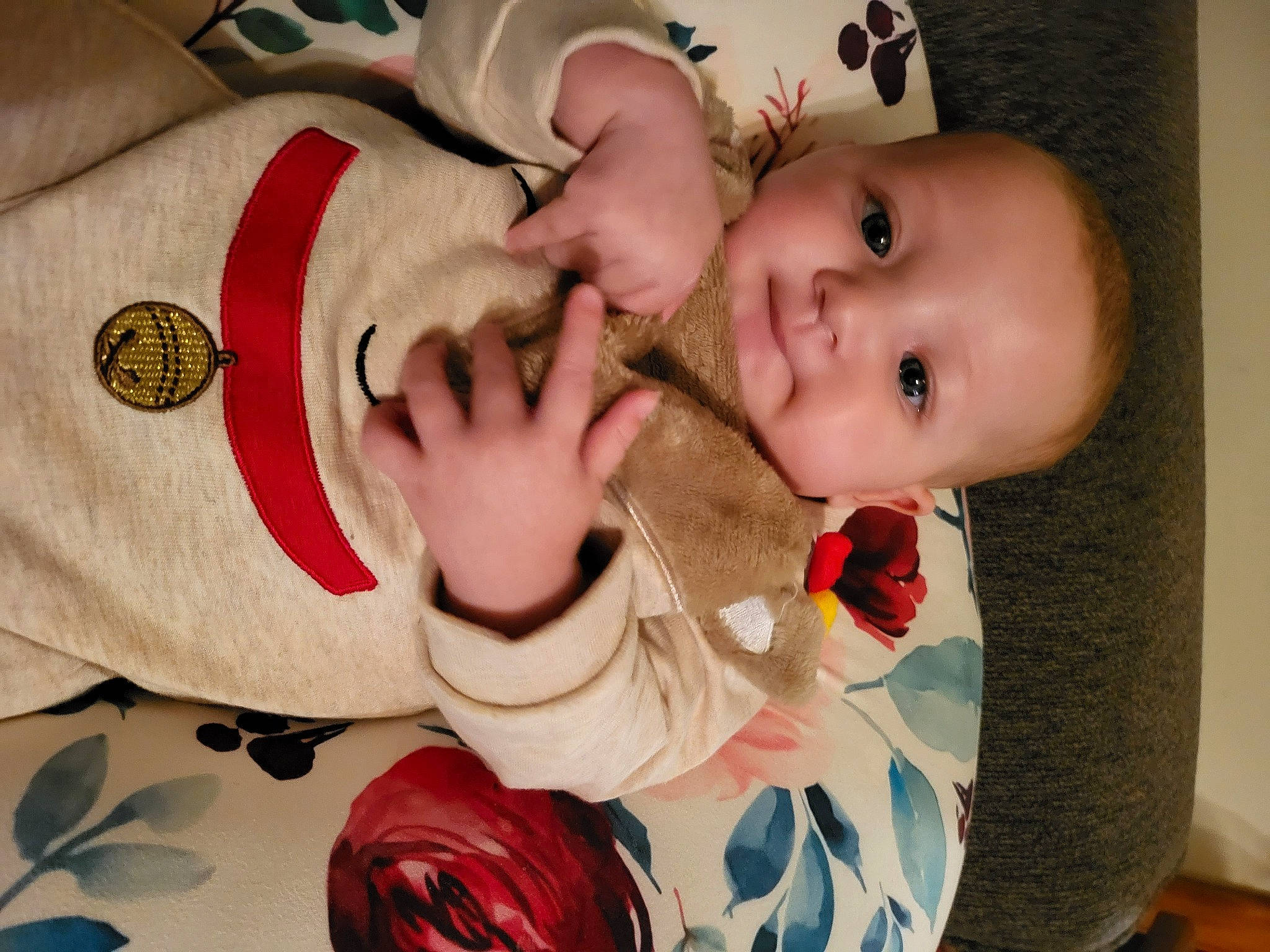 Priya is registered to the contest to win money with this photo: baby, baby_products, baby_toddler_clothing, cheek, child, comfort, eye, finger, fun, gesture, hand, happy, human_body, mouth, nail, person, petal, skin, sleeve, smile