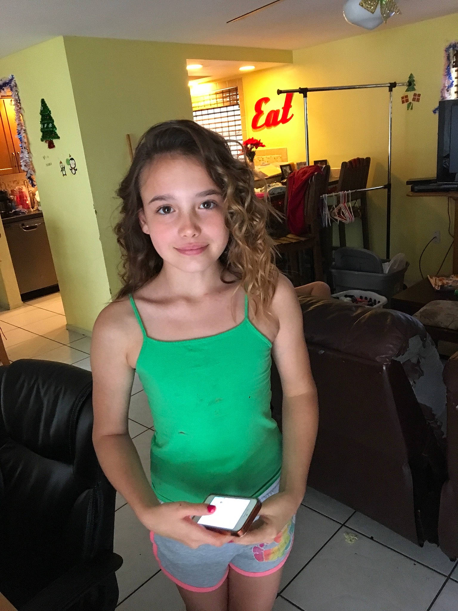 Raina is registered to the contest to win money with this photo: abdomen, arm, black_hair, brown_hair, joint, joy, leg, person, room, shorts, shoulder, smile, t_shirt, thigh, top, vacation, waist