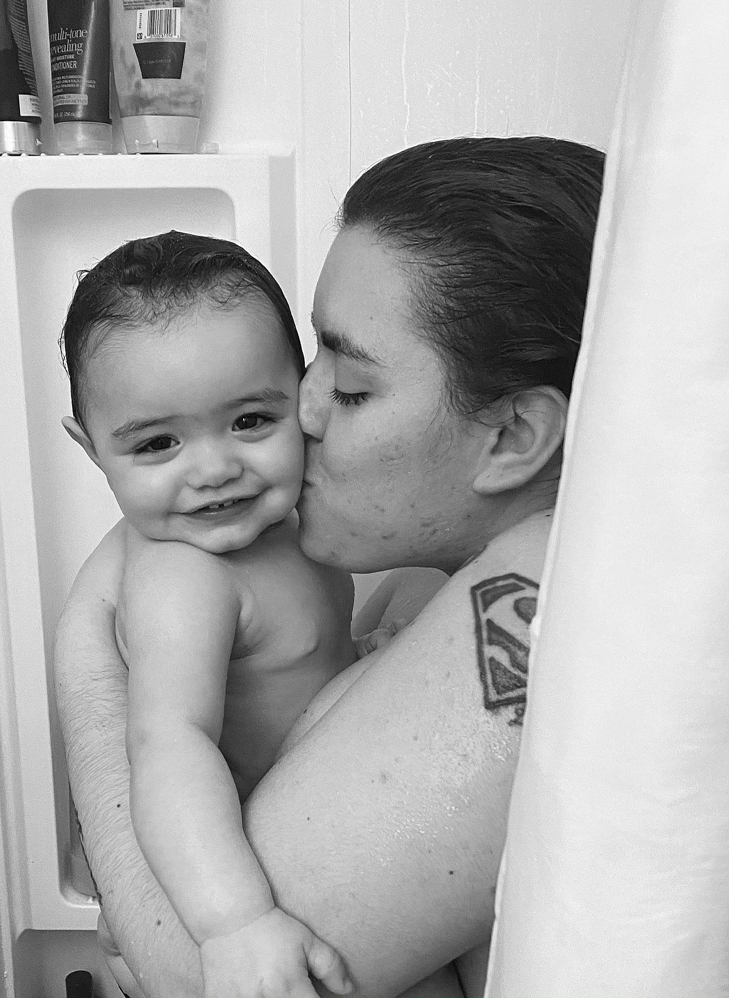 Jacqueline is registered to the contest to win money with this photo: black_and_white, cheek, eye, eyebrow, flash_photography, gesture, hair, happy, human_body, interaction, iris, joy, kiss, lip, mouth, muscle, nose, person, shoulder, skin