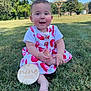 baby, child, grass, outdoor, smiling, dress, watermelon_print, foot, hand, sign, nine_months, sunny, blue_sky, tree, park, nature, happy, infant, sitting, cute