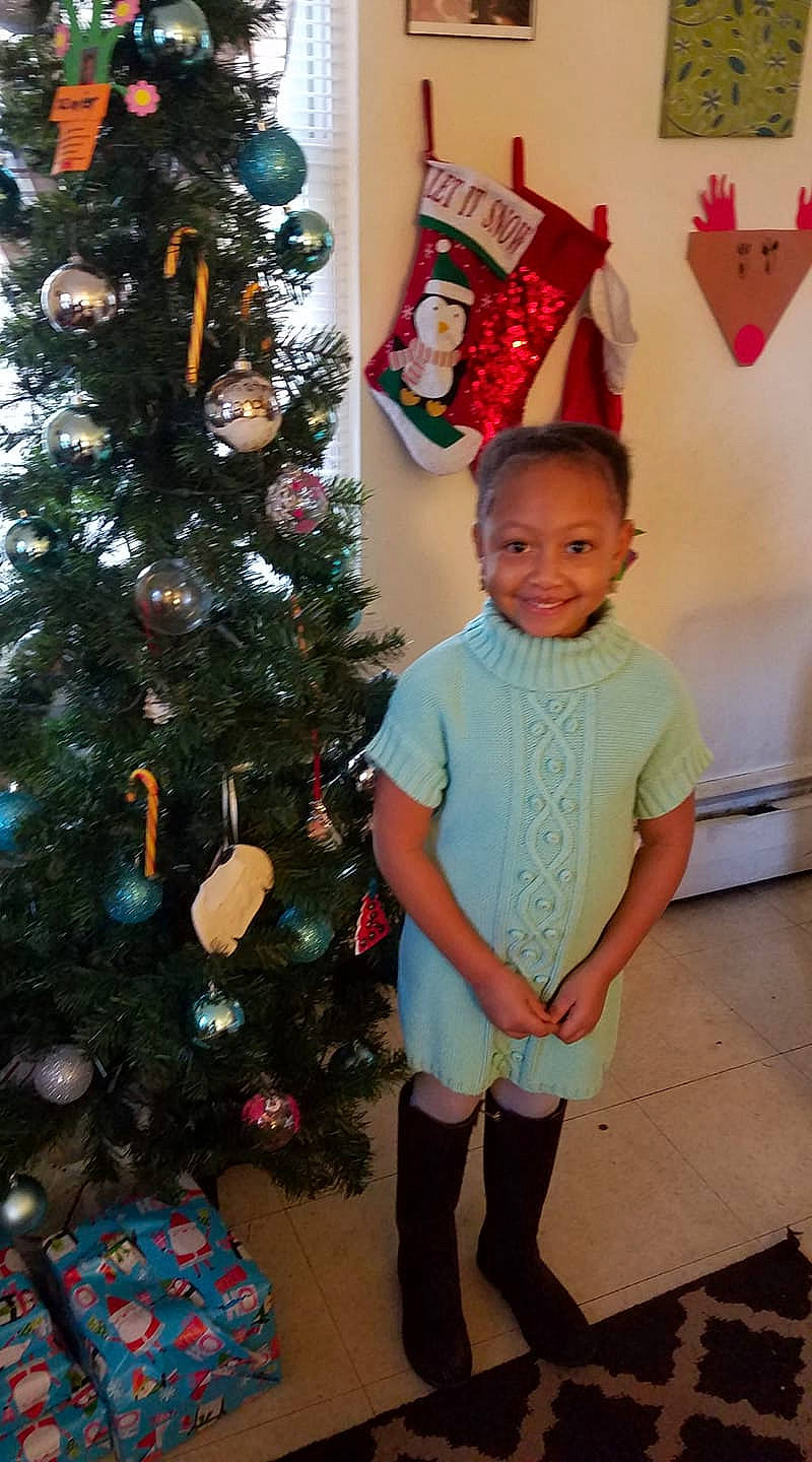 Amiera is registered to the contest to win money with this photo: christmas, christmas_decoration, christmas_ornament, christmas_tree, decor, event, holiday, joy, pattern, person, toddler