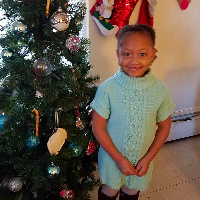 Amiera is registered to the contest to win money with this photo: christmas, christmas_decoration, christmas_ornament, christmas_tree, decor, event, holiday, joy, pattern, person, toddler