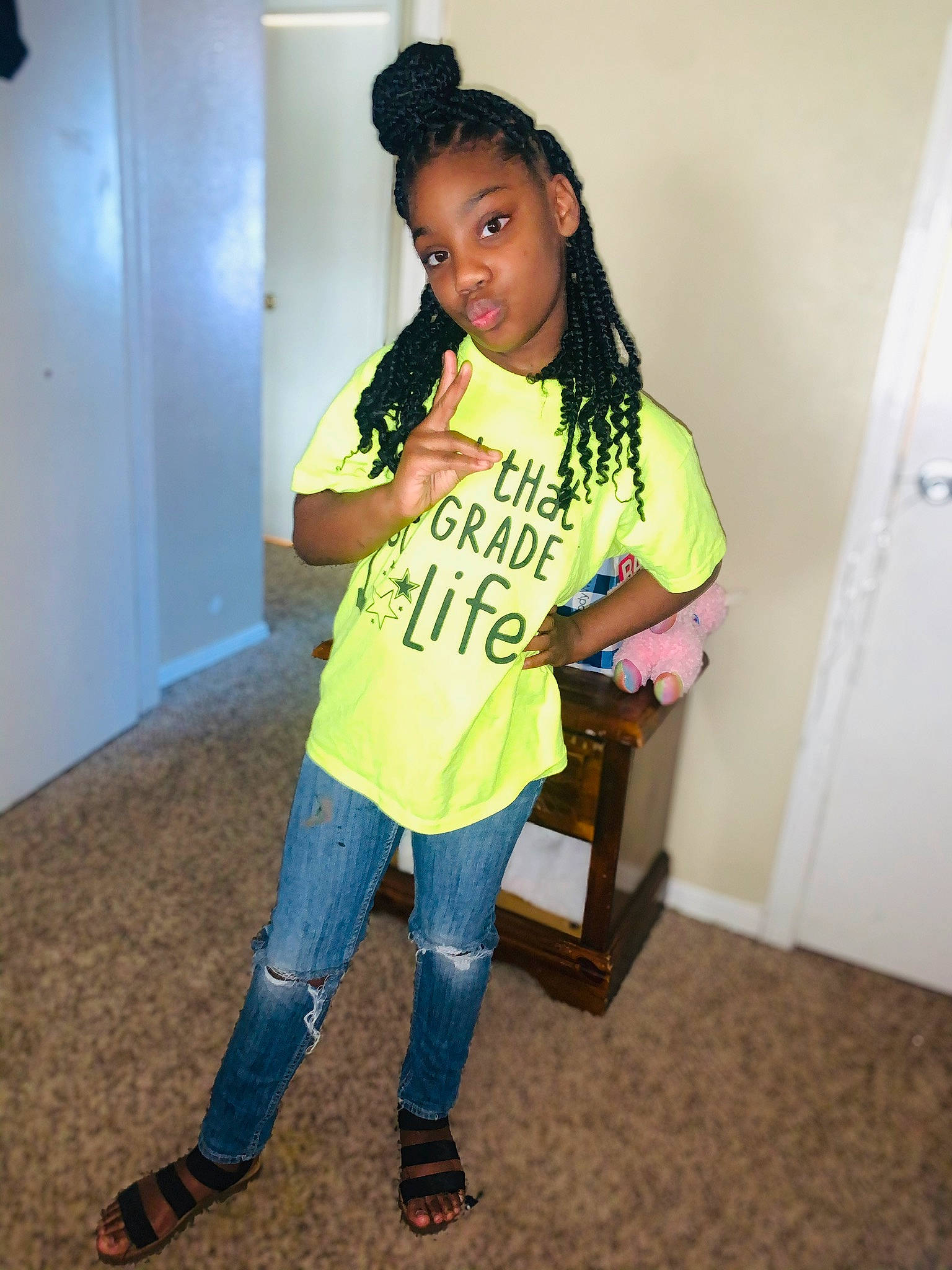 Lauren is registered to the contest to win money with this photo: black_hair, boot, denim, door, fashion_accessory, fashion_design, flooring, happy, jeans, knee, long_hair, neck, person, shoe, sleeve, sportswear, street_fashion, t_shirt, thigh, toddler