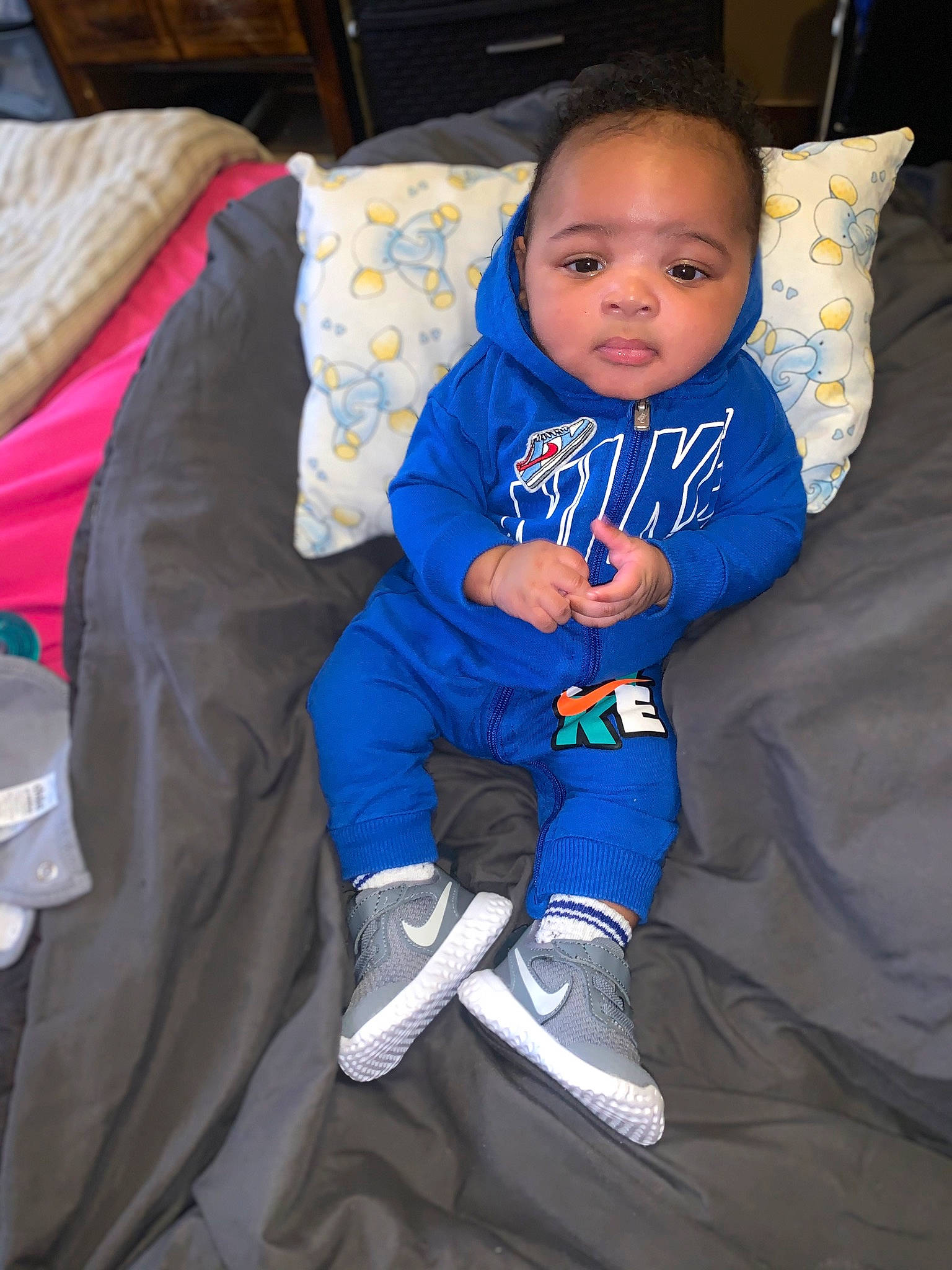 Jacob joined the competition — help win amazing prizes! baby, baby_toddler_clothing, child, comfort, couch, electric_blue, eye, face, hat, head, knee, lap, linens, person, pillow, sitting, sleeve, smile, sock, toddler