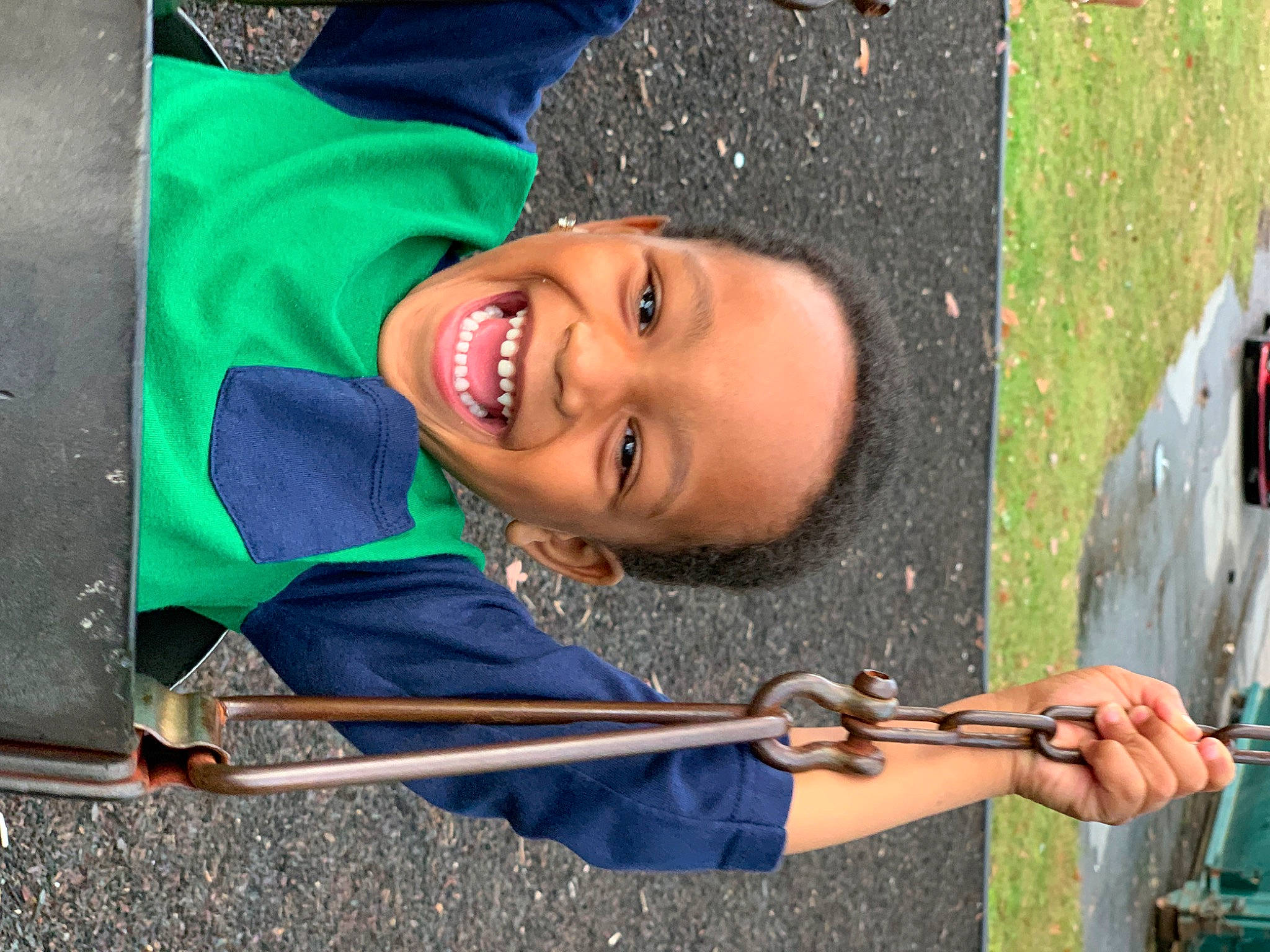 Donald is registered to the contest to win money with this photo: child, community, cool, electric_blue, fun, grass, happy, joy, laugh, leisure, outdoor_play_equipment, person, plant, play, public_space, recreation, smile, t_shirt, tree, vacation