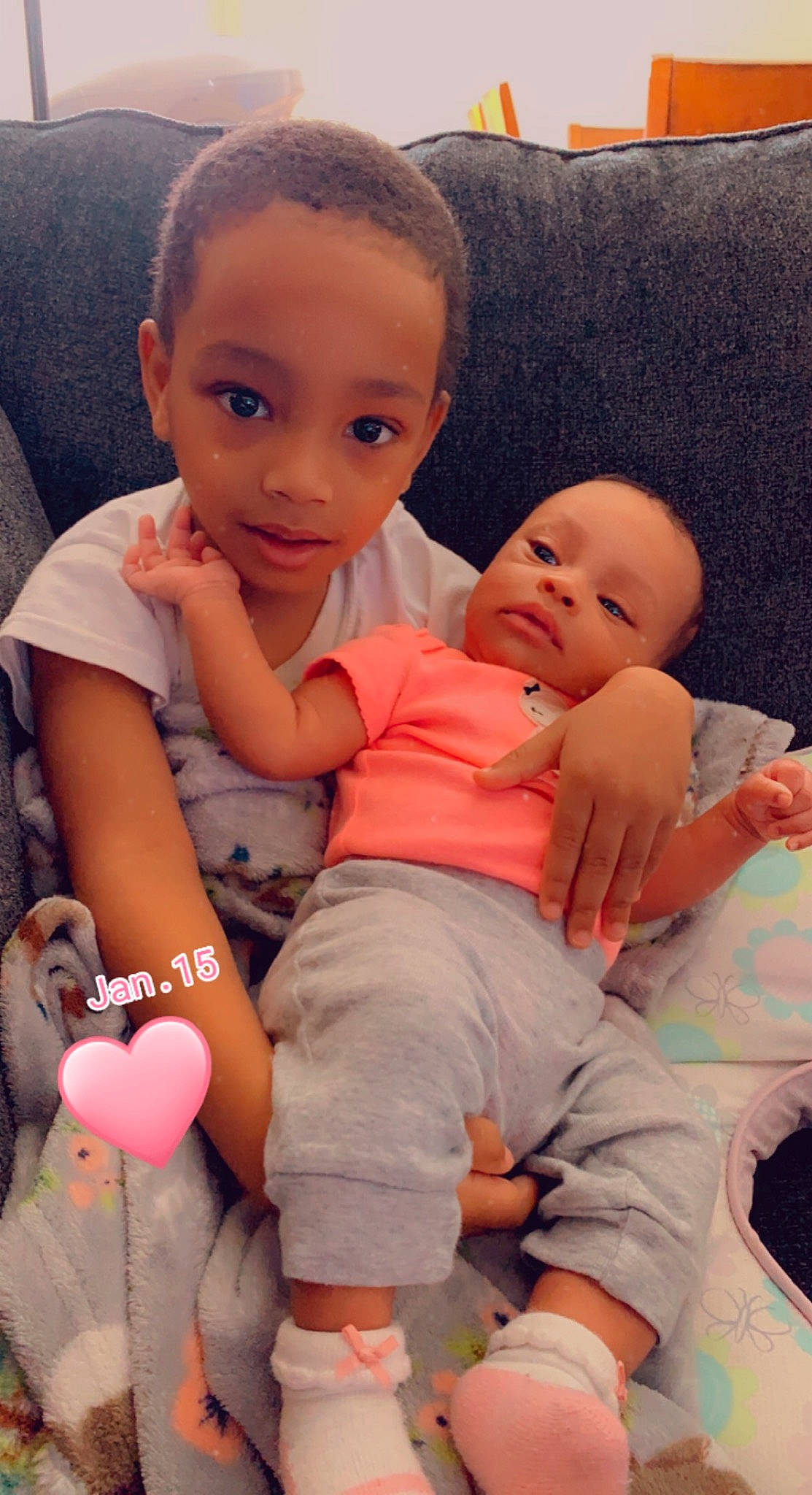 Donald is registered to the contest to win money with this photo: baby_toddler_clothing, cheek, comfort, eye, facial_expression, finger, hairstyle, happy, head, interaction, iris, lap, lip, mouth, muscle, nose, person, pink, product, skin