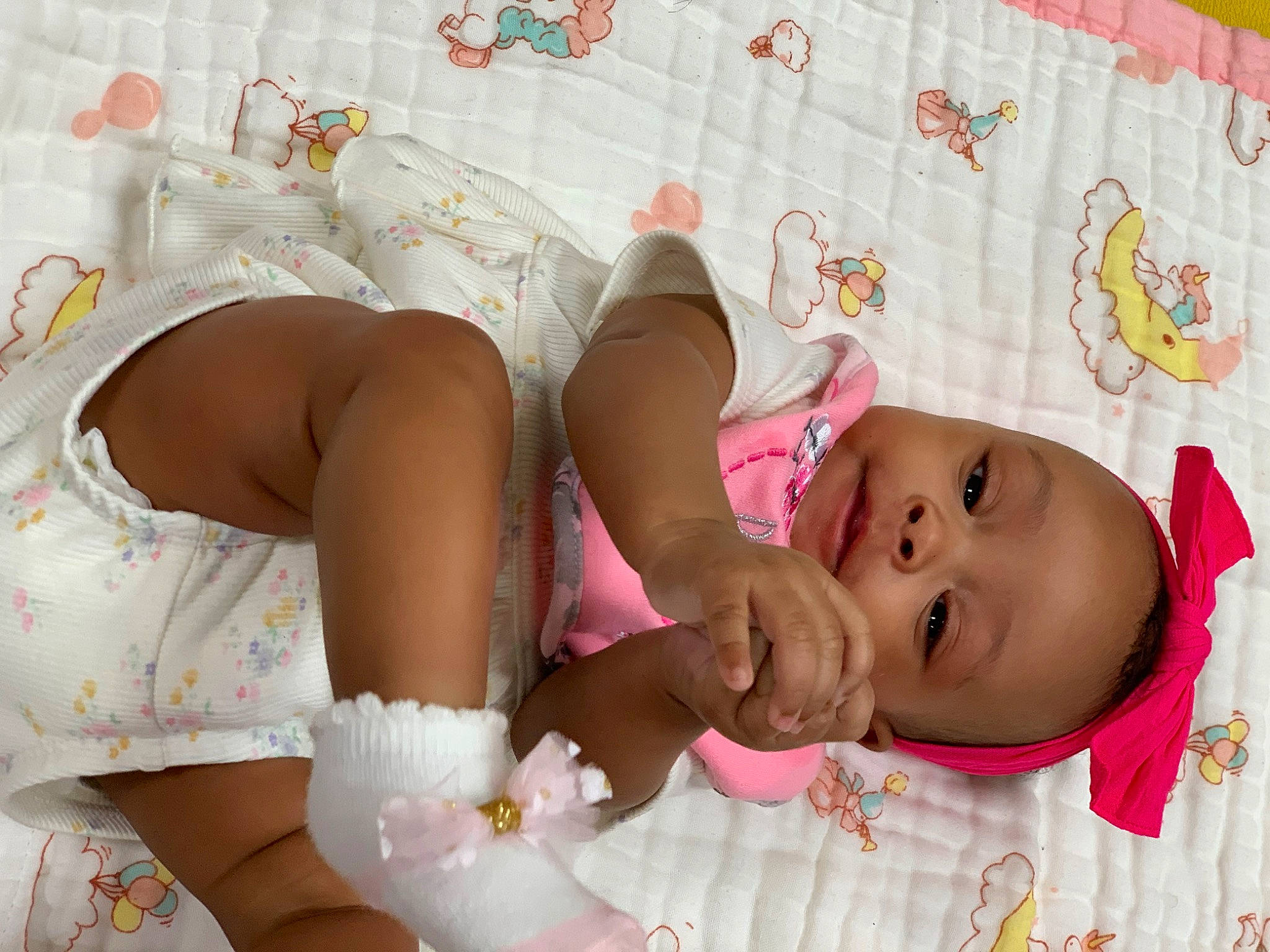 Azariah joined the competition — help win amazing prizes! baby, baby_products, baby_safety, baby_toddler_clothing, bedding, child, comfort, happy, hat, headgear, human_leg, linens, pattern, person, pink, room, skin, sleeve, textile, thigh