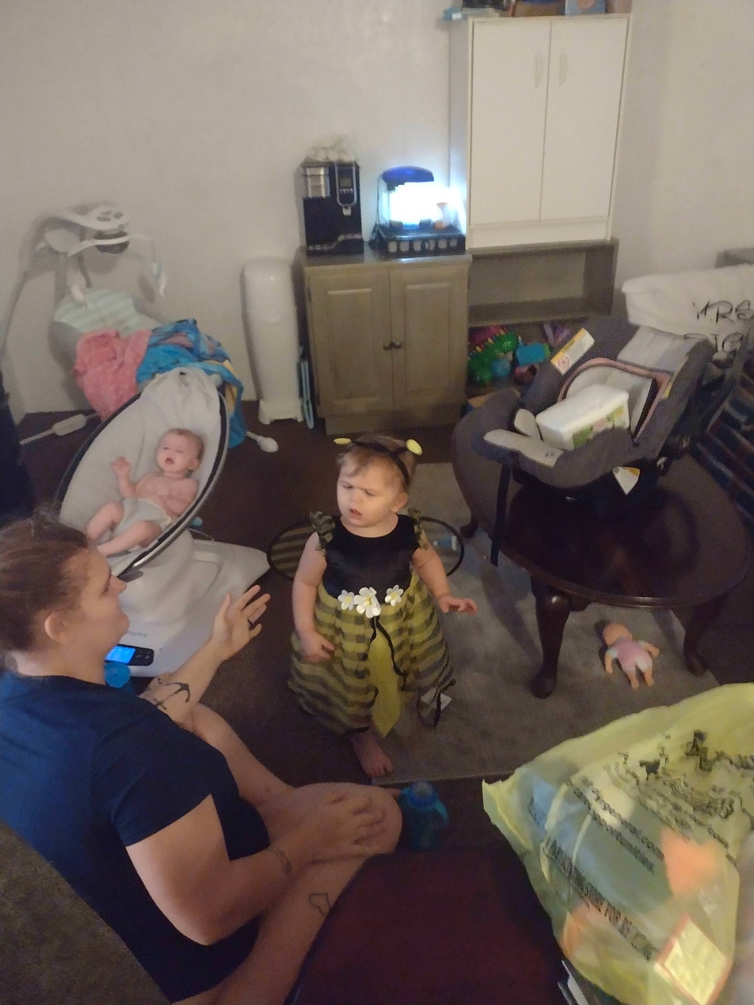 Emma joined the competition — help win amazing prizes! child, comfort, couch, desk, drawer, electronic_device, event, flooring, fun, hat, lap, living_room, person, play, room, shorts, sitting, t_shirt, table, television