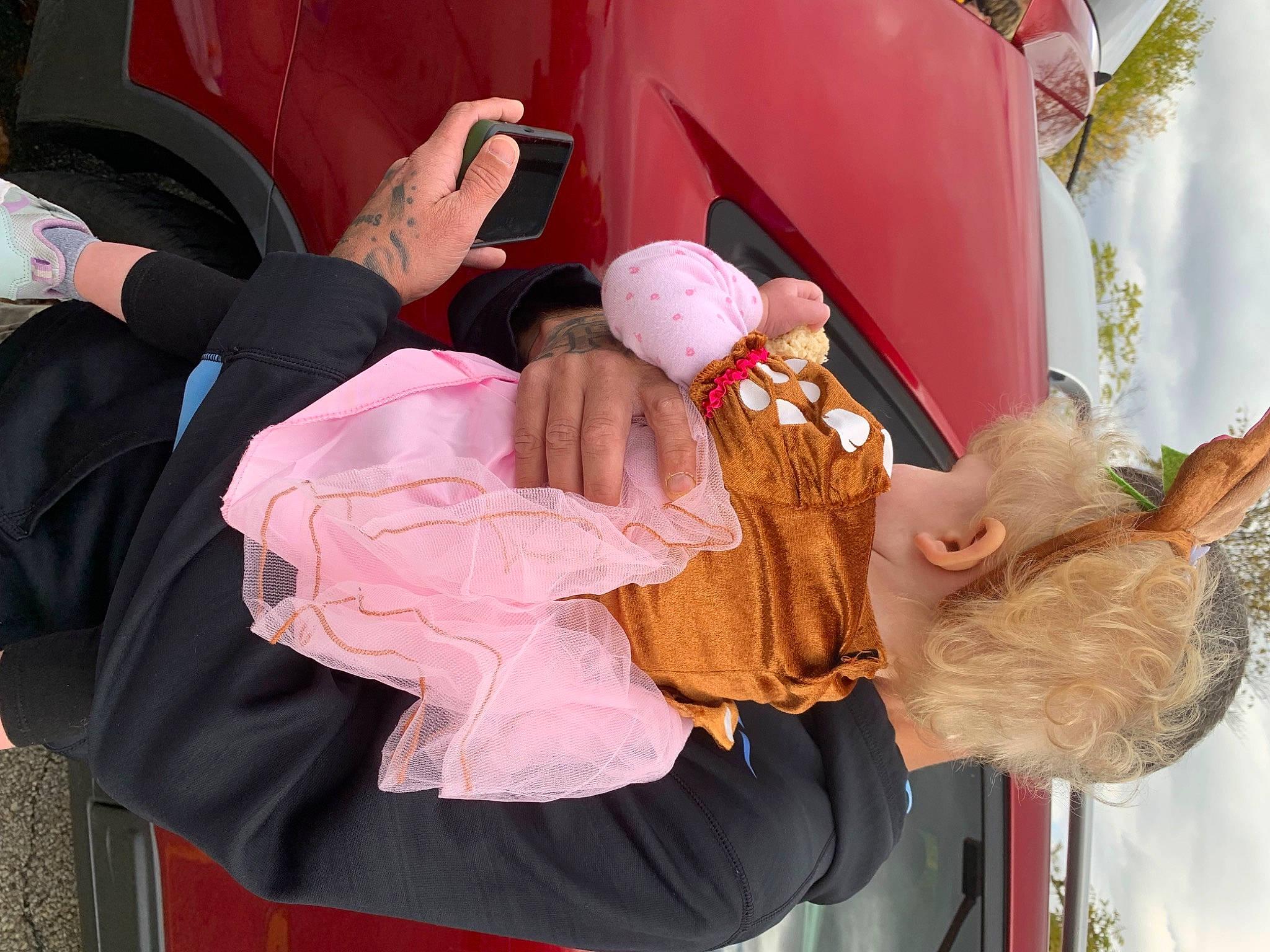 Abriella joined the competition — help win amazing prizes! baby, baby_products, child, costume, event, fun, fur, hat, lap, leisure, magenta, person, pink, sitting, textile, toddler, tradition, tree, vacation