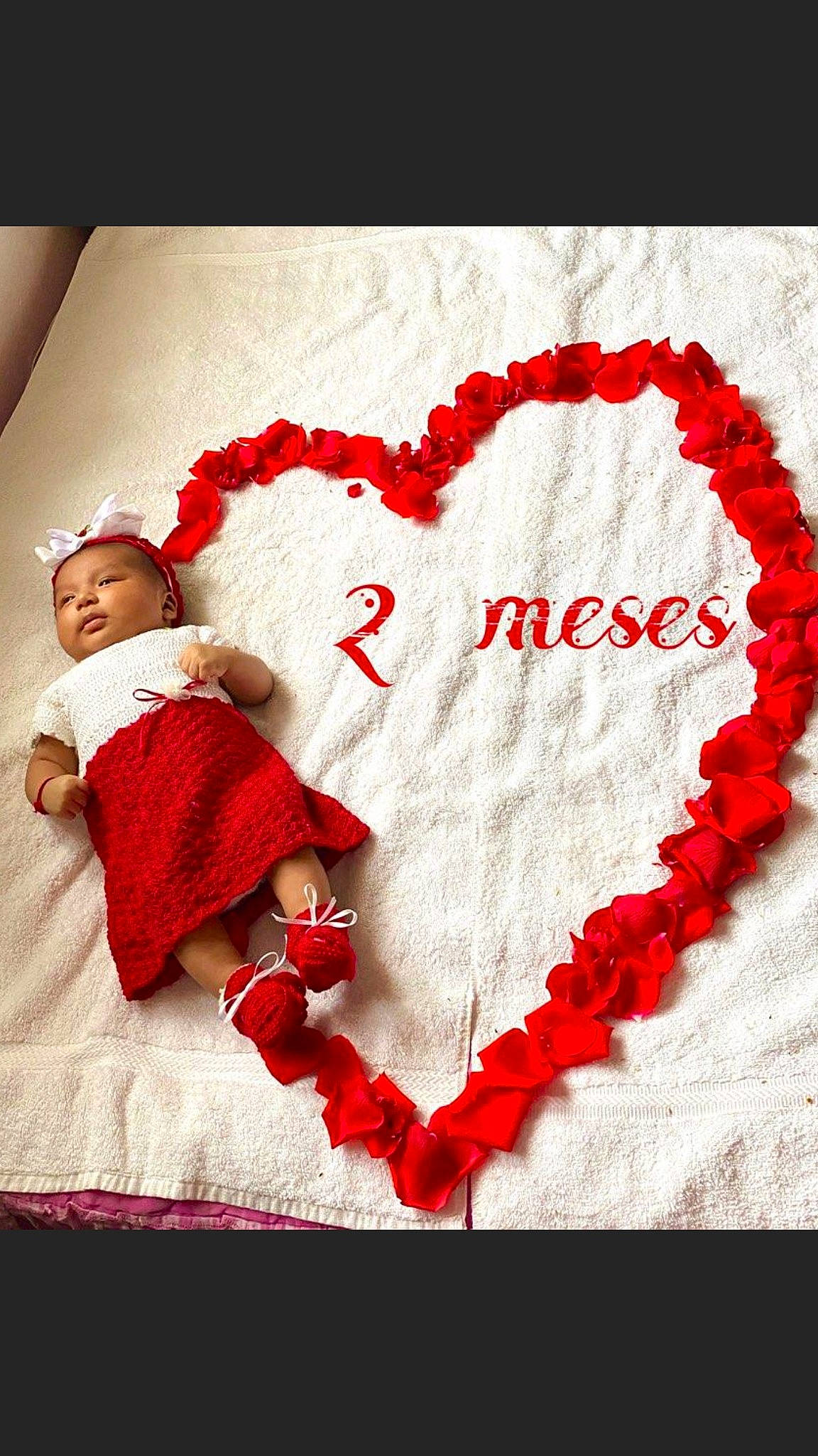 Angela is registered to the contest to win money with this photo: child, heart, human_body, love, organ, person, red, smile, textile, toddler, valentines_day