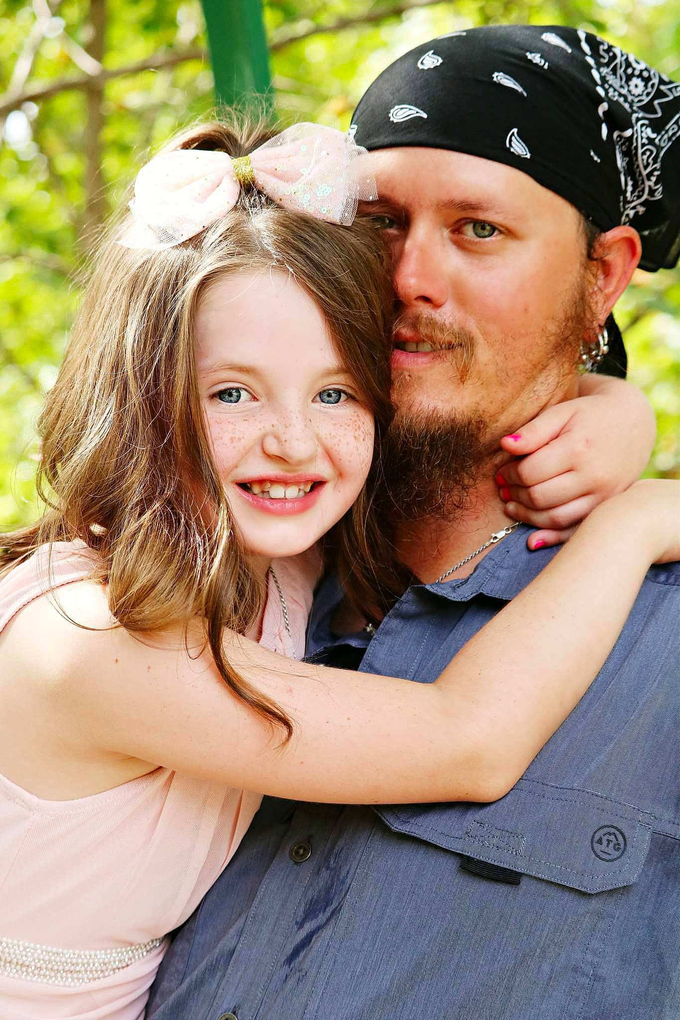 Raeleigh joined the competition — help win amazing prizes! beard, blond, cap, child, clothing, event, flash_photography, fun, gesture, grass, happy, headwear, hug, joy, leaf, leisure, people_in_nature, person, recreation, smile