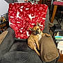 dog, french_bulldog, armchair, blanket, christmas_tree, holiday_decor, living_room, furniture, pet, canine, indoor, cozy, festive, reindeer_pattern, red_blanket, relaxed, seated, brown_dog, decorations, home
