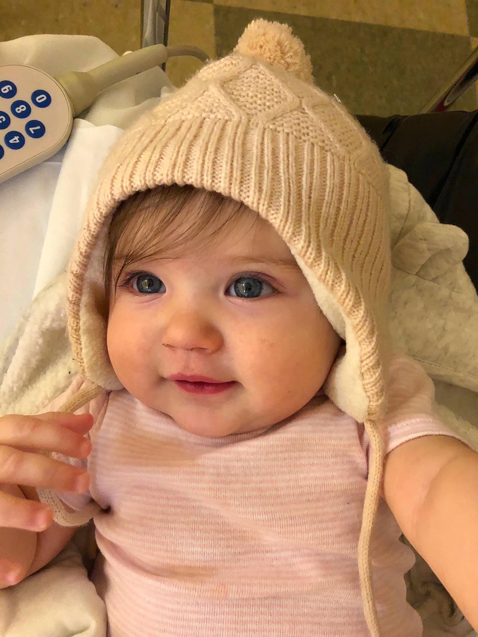 Annabel is registered to the contest to win money with this photo: baby, bonnet, cap, cheek, child, hat, headgear, headwear, knit_cap, lip, outerwear, person, skin, toddler