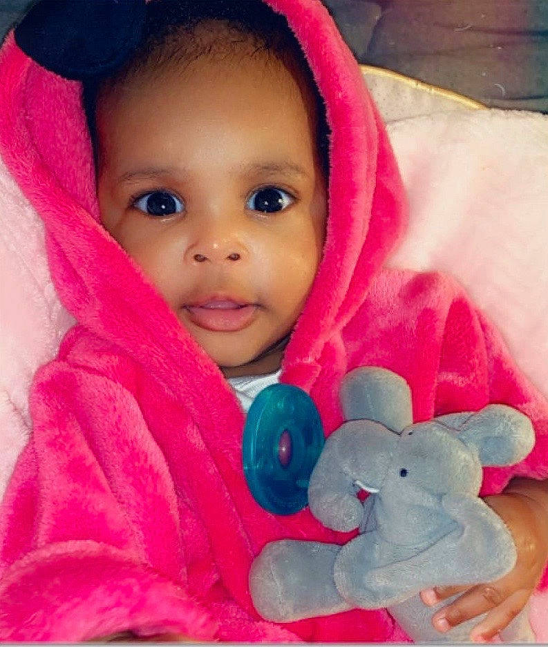 Madysen is registered to the contest to win money with this photo: baby, baby_toys, cheek, child, ear, face, head, lip, magenta, person, pink, play, plush, skin, smile, stuffed_toy, textile, toddler, toy