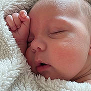 Heath joined the competition — help win amazing prizes! baby, infant, newborn, sleeping, blanket, cozy, close_up, face, cheek, hand, fingers, thumb, peaceful, plush_blanket, soft_texture, skin, portrait, mouth, eyelids, bedding