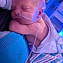 newborn, baby, sleeping, hospital, nasal_tube, blanket, person, skin, medical, care, rest, infant, hospital_bed, blue_light, striped_blanket, towel, closeup, peaceful, hospital_room, wrapped