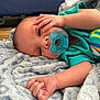 baby, pacifier, blanket, infant, sleepy, hand, face, clothing, blue, soft, cute, lying_down, newborn, skin, eyes, expression, indoors, comfort, rest, child