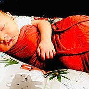 Bentley joined the competition — help win amazing prizes! baby, newborn, sleeping, blanket, red_blanket, cushion, animal_print, hand, face, peaceful, resting, infant, soft, comfort, indoors, cute, portrait, child, cozy, nap